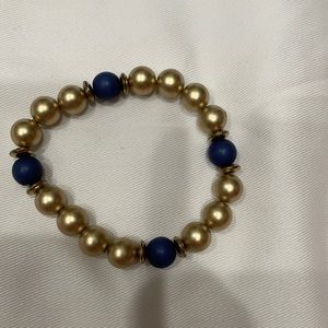 Gold and navy bead bracelet.
